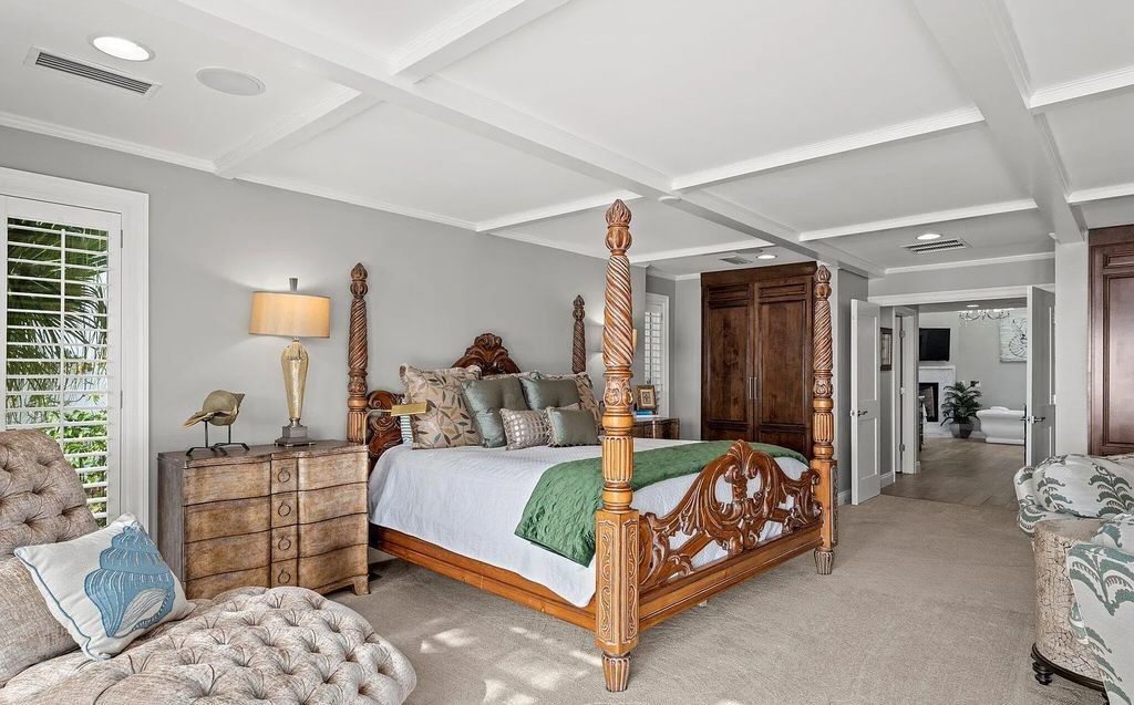 4600 Bay Point Road, Panama City Beach, Florida, is an exceptionally luxurious home with a Tropical Poolside Oasis with smart furnishings, soaring vaulted wood beam ceilings, a curving staircase, and an expansive living room featuring a well-appointed fireplace and triple French doors that lead to the elevated deck. This Home in Panama City Beach offers 6 bedrooms and 8 bathrooms with over 6.000 square feet of living spaces.