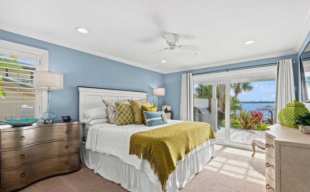 4600 Bay Point Road, Panama City Beach, Florida, is an exceptionally luxurious home with a Tropical Poolside Oasis with smart furnishings, soaring vaulted wood beam ceilings, a curving staircase, and an expansive living room featuring a well-appointed fireplace and triple French doors that lead to the elevated deck. This Home in Panama City Beach offers 6 bedrooms and 8 bathrooms with over 6.000 square feet of living spaces.