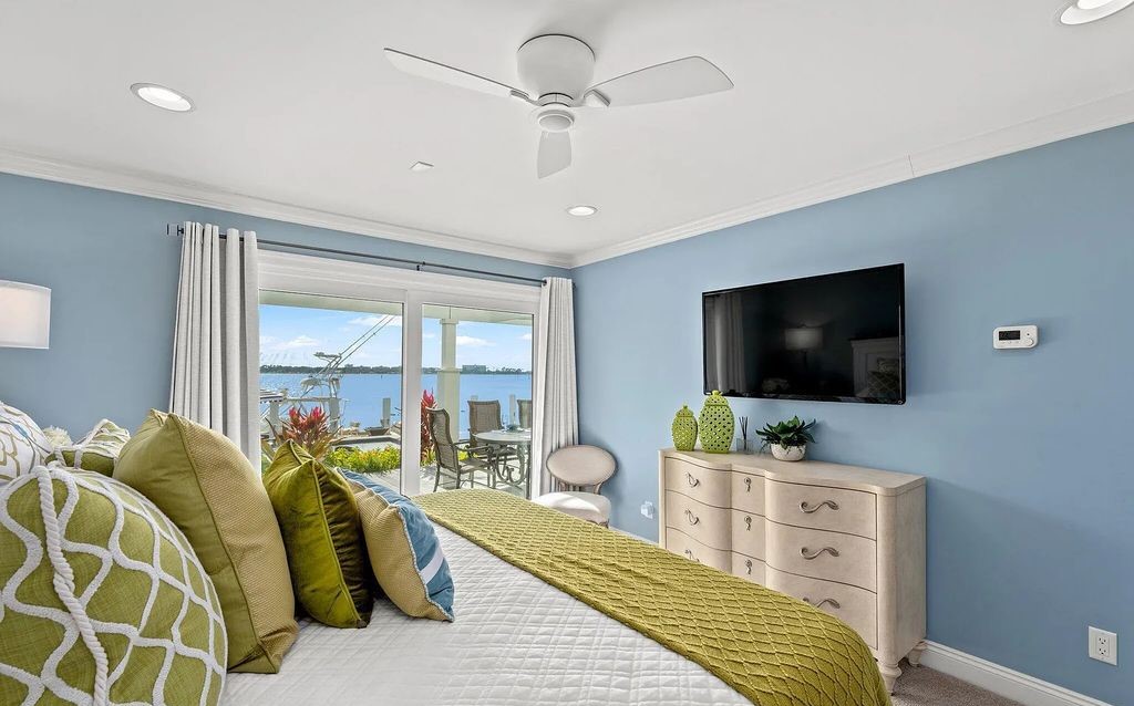 4600 Bay Point Road, Panama City Beach, Florida, is an exceptionally luxurious home with a Tropical Poolside Oasis with smart furnishings, soaring vaulted wood beam ceilings, a curving staircase, and an expansive living room featuring a well-appointed fireplace and triple French doors that lead to the elevated deck. This Home in Panama City Beach offers 6 bedrooms and 8 bathrooms with over 6.000 square feet of living spaces.
