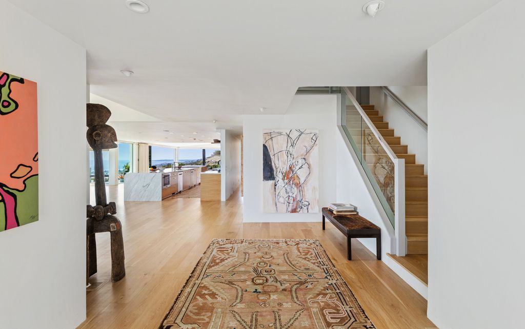 22407 Carbon Mesa Road, Malibu, California is truly a golfer's retreat in a spectacular, verdant setting on a gated promontory of more than two manicured acres on two parcels, views that take in a panorama of ocean, islands, and coastline from Point Dume and the Malibu Pier to Palos Verdes.