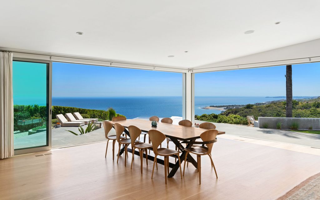 22407 Carbon Mesa Road, Malibu, California is truly a golfer's retreat in a spectacular, verdant setting on a gated promontory of more than two manicured acres on two parcels, views that take in a panorama of ocean, islands, and coastline from Point Dume and the Malibu Pier to Palos Verdes.
