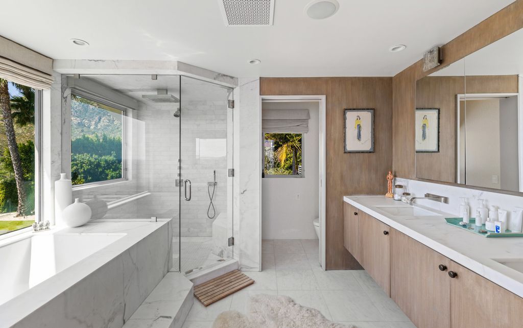 22407 Carbon Mesa Road, Malibu, California is truly a golfer's retreat in a spectacular, verdant setting on a gated promontory of more than two manicured acres on two parcels, views that take in a panorama of ocean, islands, and coastline from Point Dume and the Malibu Pier to Palos Verdes.