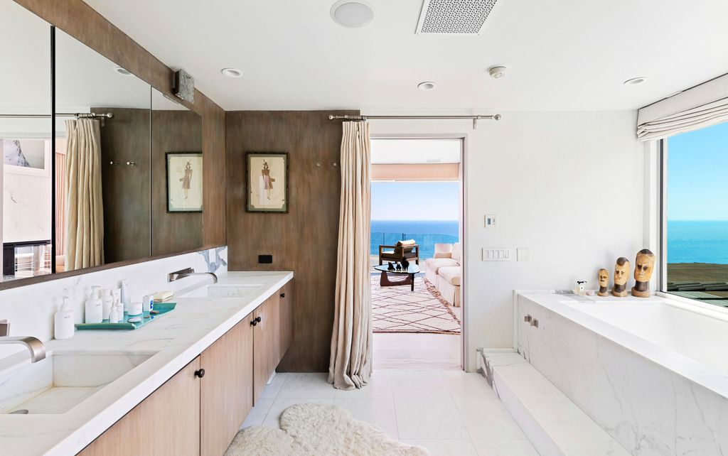 22407 Carbon Mesa Road, Malibu, California is truly a golfer's retreat in a spectacular, verdant setting on a gated promontory of more than two manicured acres on two parcels, views that take in a panorama of ocean, islands, and coastline from Point Dume and the Malibu Pier to Palos Verdes.