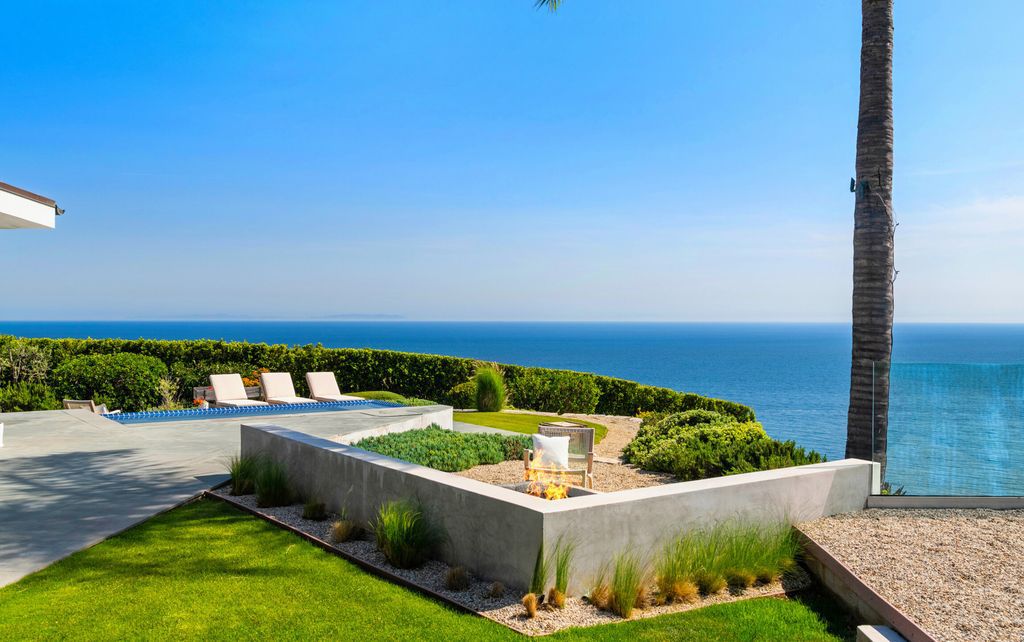 22407 Carbon Mesa Road, Malibu, California is truly a golfer's retreat in a spectacular, verdant setting on a gated promontory of more than two manicured acres on two parcels, views that take in a panorama of ocean, islands, and coastline from Point Dume and the Malibu Pier to Palos Verdes.