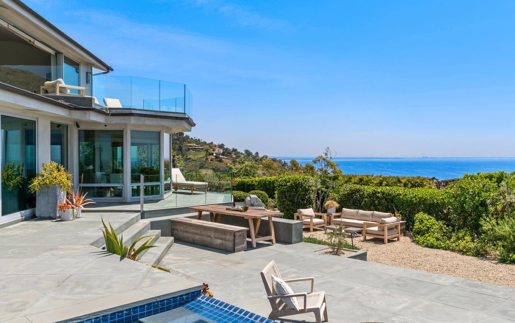 22407 Carbon Mesa Road, Malibu, California is truly a golfer's retreat in a spectacular, verdant setting on a gated promontory of more than two manicured acres on two parcels, views that take in a panorama of ocean, islands, and coastline from Point Dume and the Malibu Pier to Palos Verdes.