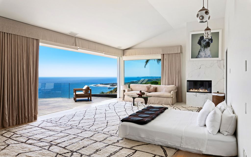 22407 Carbon Mesa Road, Malibu, California is truly a golfer's retreat in a spectacular, verdant setting on a gated promontory of more than two manicured acres on two parcels, views that take in a panorama of ocean, islands, and coastline from Point Dume and the Malibu Pier to Palos Verdes.