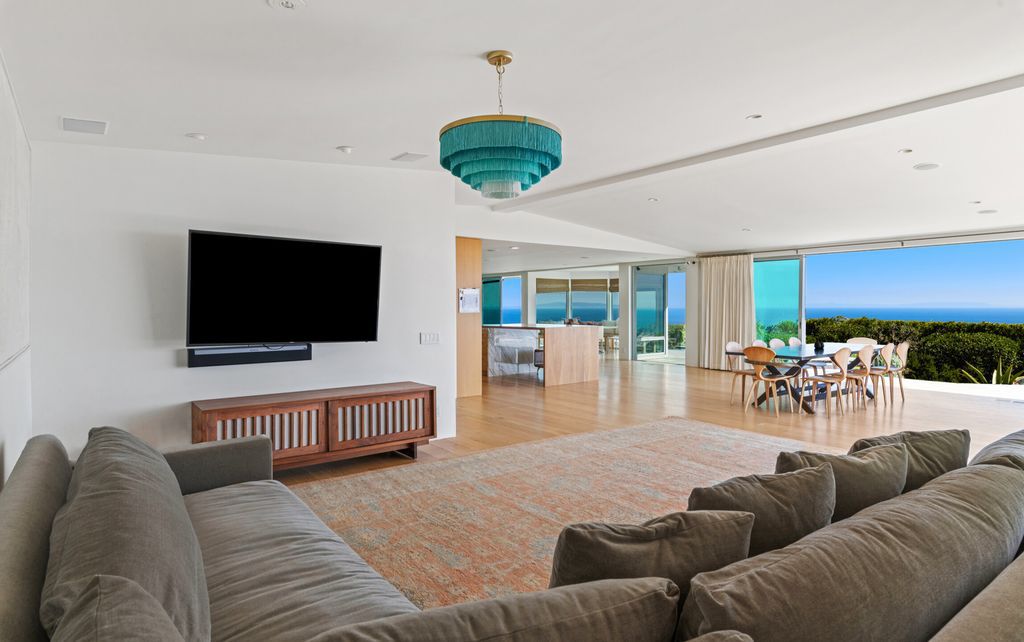 22407 Carbon Mesa Road, Malibu, California is truly a golfer's retreat in a spectacular, verdant setting on a gated promontory of more than two manicured acres on two parcels, views that take in a panorama of ocean, islands, and coastline from Point Dume and the Malibu Pier to Palos Verdes.