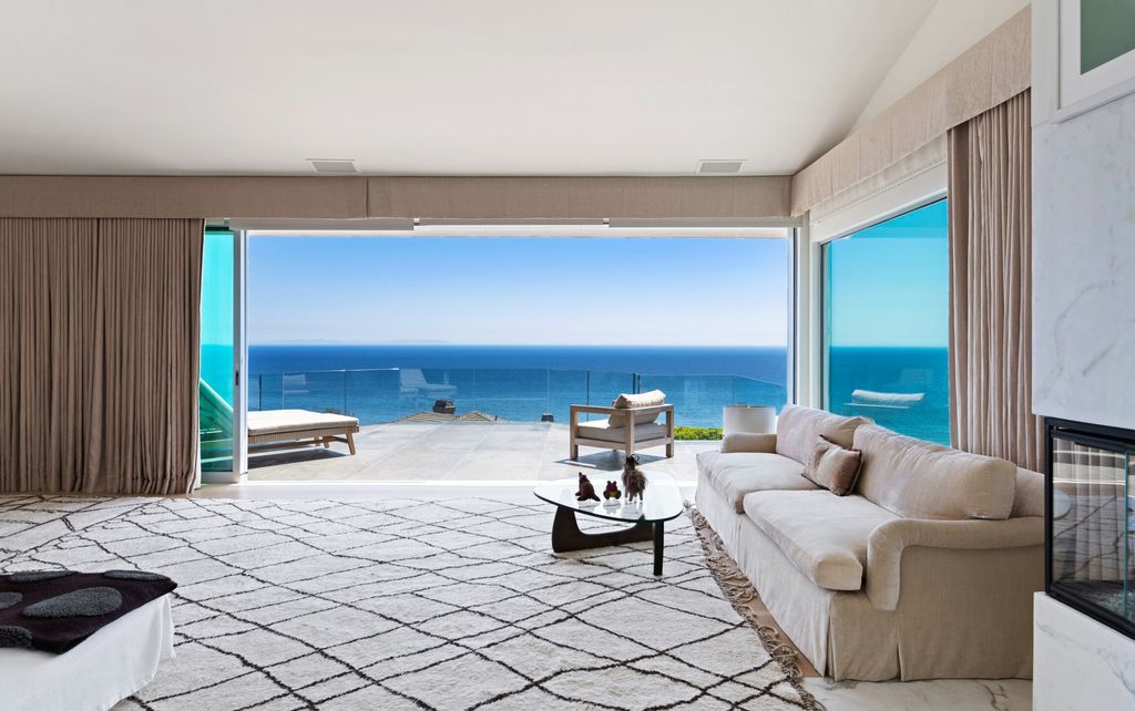 22407 Carbon Mesa Road, Malibu, California is truly a golfer's retreat in a spectacular, verdant setting on a gated promontory of more than two manicured acres on two parcels, views that take in a panorama of ocean, islands, and coastline from Point Dume and the Malibu Pier to Palos Verdes.