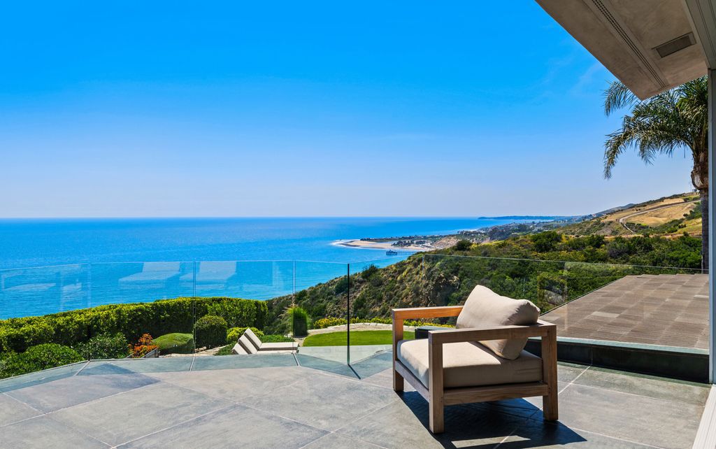 22407 Carbon Mesa Road, Malibu, California is truly a golfer's retreat in a spectacular, verdant setting on a gated promontory of more than two manicured acres on two parcels, views that take in a panorama of ocean, islands, and coastline from Point Dume and the Malibu Pier to Palos Verdes.