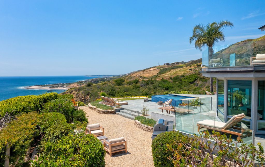 22407 Carbon Mesa Road, Malibu, California is truly a golfer's retreat in a spectacular, verdant setting on a gated promontory of more than two manicured acres on two parcels, views that take in a panorama of ocean, islands, and coastline from Point Dume and the Malibu Pier to Palos Verdes.