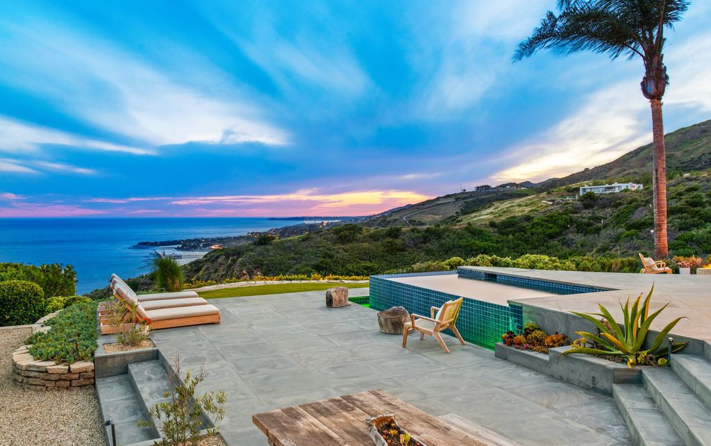 22407 Carbon Mesa Road, Malibu, California is truly a golfer's retreat in a spectacular, verdant setting on a gated promontory of more than two manicured acres on two parcels, views that take in a panorama of ocean, islands, and coastline from Point Dume and the Malibu Pier to Palos Verdes.