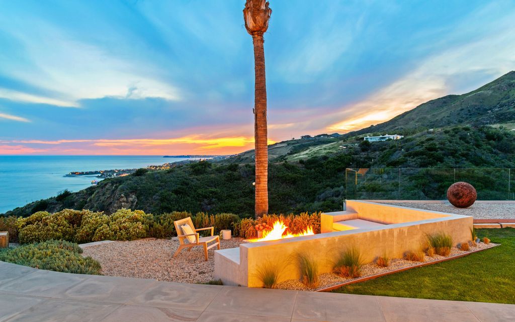 22407 Carbon Mesa Road, Malibu, California is truly a golfer's retreat in a spectacular, verdant setting on a gated promontory of more than two manicured acres on two parcels, views that take in a panorama of ocean, islands, and coastline from Point Dume and the Malibu Pier to Palos Verdes.