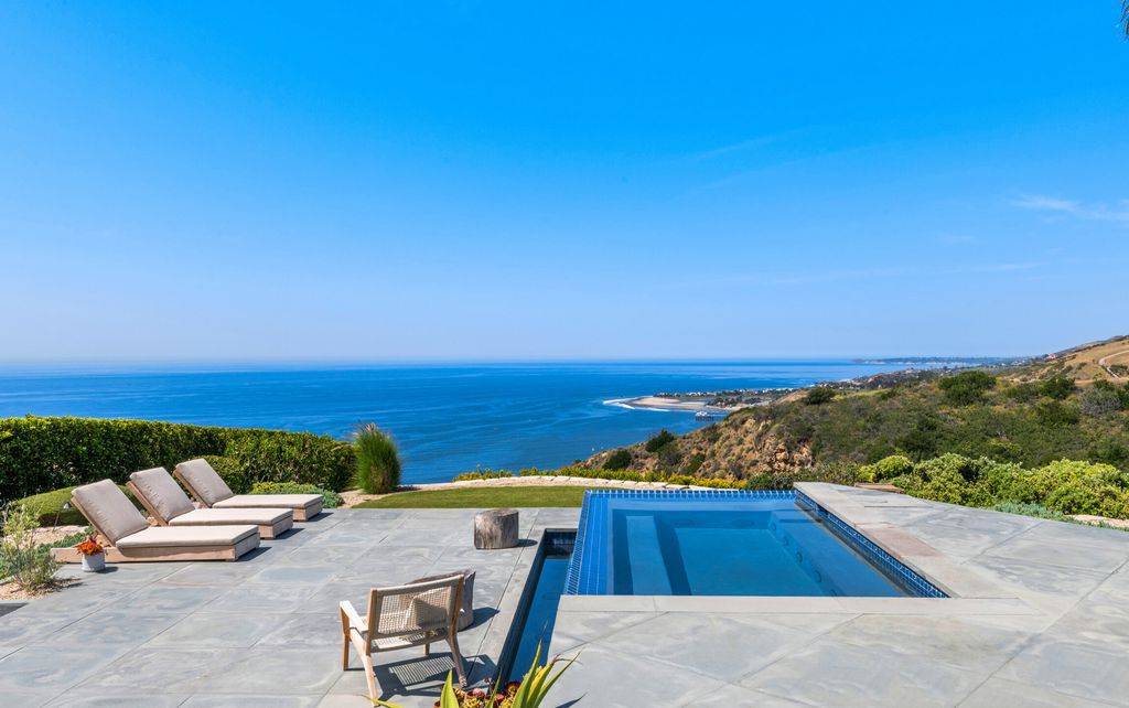 22407 Carbon Mesa Road, Malibu, California is truly a golfer's retreat in a spectacular, verdant setting on a gated promontory of more than two manicured acres on two parcels, views that take in a panorama of ocean, islands, and coastline from Point Dume and the Malibu Pier to Palos Verdes.