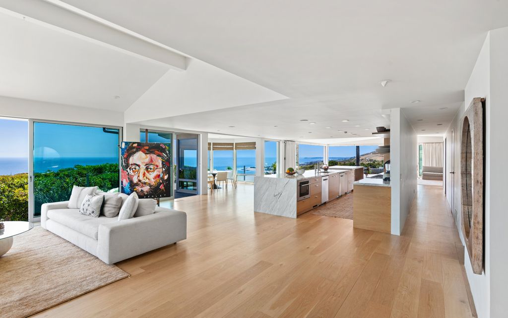 22407 Carbon Mesa Road, Malibu, California is truly a golfer's retreat in a spectacular, verdant setting on a gated promontory of more than two manicured acres on two parcels, views that take in a panorama of ocean, islands, and coastline from Point Dume and the Malibu Pier to Palos Verdes.