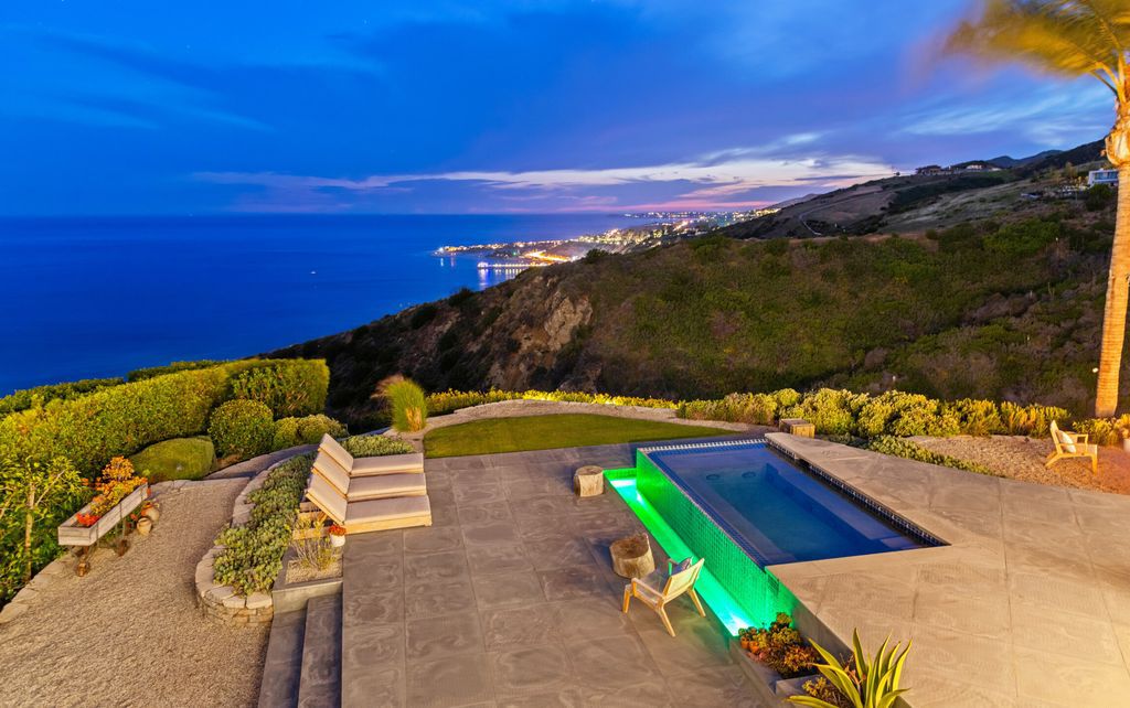 22407 Carbon Mesa Road, Malibu, California is truly a golfer's retreat in a spectacular, verdant setting on a gated promontory of more than two manicured acres on two parcels, views that take in a panorama of ocean, islands, and coastline from Point Dume and the Malibu Pier to Palos Verdes.