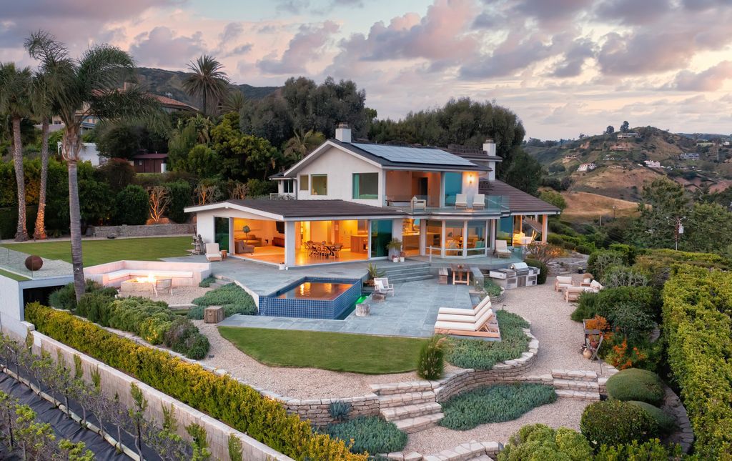 22407 Carbon Mesa Road, Malibu, California is truly a golfer's retreat in a spectacular, verdant setting on a gated promontory of more than two manicured acres on two parcels, views that take in a panorama of ocean, islands, and coastline from Point Dume and the Malibu Pier to Palos Verdes.