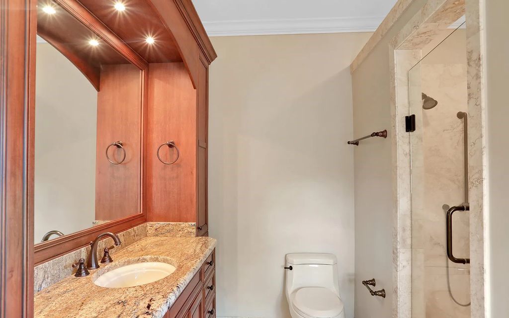13897 Bella Riva Lane, Jacksonville, Florida, is located on the intracoastal waterway in prestigious Queen's Harbour and is perfect for formal or casual entertaining. The elegant, contemporary home has a 2-story layout with panoramic vistas of the Intracoastal and marshes, offering privacy and spectacular views.