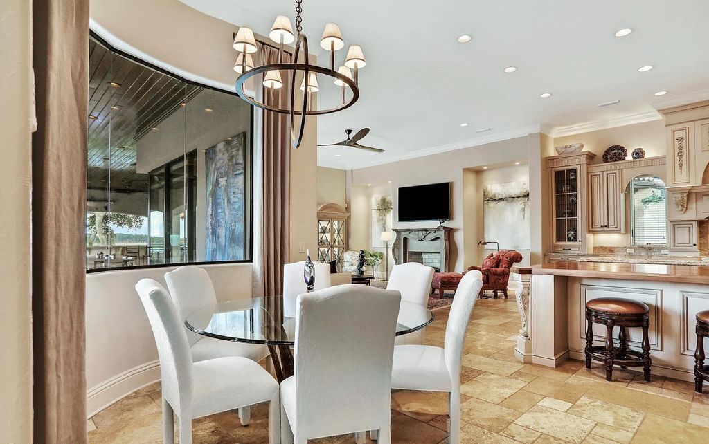 13897 Bella Riva Lane, Jacksonville, Florida, is located on the intracoastal waterway in prestigious Queen's Harbour and is perfect for formal or casual entertaining. The elegant, contemporary home has a 2-story layout with panoramic vistas of the Intracoastal and marshes, offering privacy and spectacular views.
