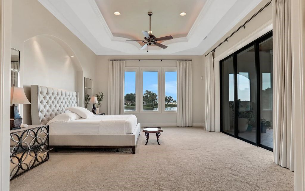 13897 Bella Riva Lane, Jacksonville, Florida, is located on the intracoastal waterway in prestigious Queen's Harbour and is perfect for formal or casual entertaining. The elegant, contemporary home has a 2-story layout with panoramic vistas of the Intracoastal and marshes, offering privacy and spectacular views.