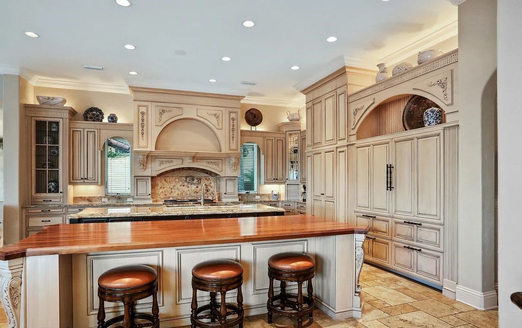 13897 Bella Riva Lane, Jacksonville, Florida, is located on the intracoastal waterway in prestigious Queen's Harbour and is perfect for formal or casual entertaining. The elegant, contemporary home has a 2-story layout with panoramic vistas of the Intracoastal and marshes, offering privacy and spectacular views.