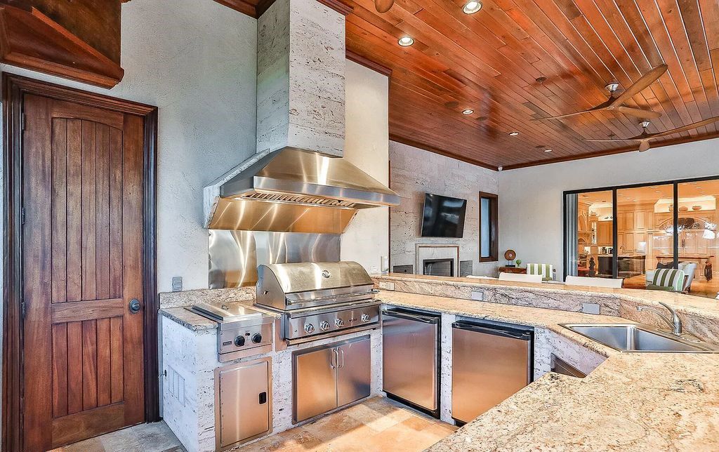 13897 Bella Riva Lane, Jacksonville, Florida, is located on the intracoastal waterway in prestigious Queen's Harbour and is perfect for formal or casual entertaining. The elegant, contemporary home has a 2-story layout with panoramic vistas of the Intracoastal and marshes, offering privacy and spectacular views.