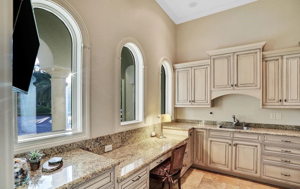 13897 Bella Riva Lane, Jacksonville, Florida, is located on the intracoastal waterway in prestigious Queen's Harbour and is perfect for formal or casual entertaining. The elegant, contemporary home has a 2-story layout with panoramic vistas of the Intracoastal and marshes, offering privacy and spectacular views.