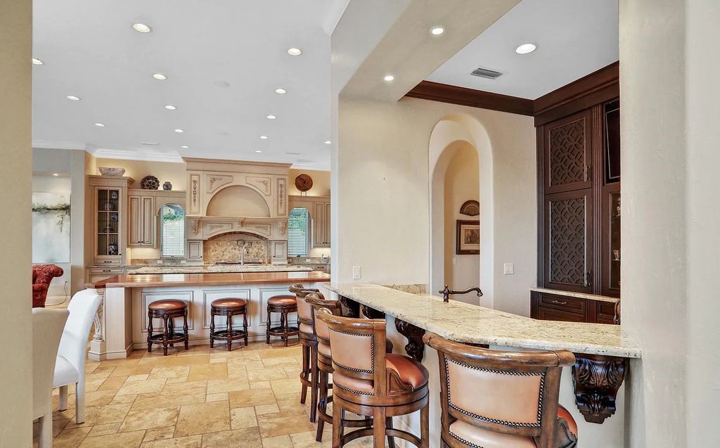 13897 Bella Riva Lane, Jacksonville, Florida, is located on the intracoastal waterway in prestigious Queen's Harbour and is perfect for formal or casual entertaining. The elegant, contemporary home has a 2-story layout with panoramic vistas of the Intracoastal and marshes, offering privacy and spectacular views.