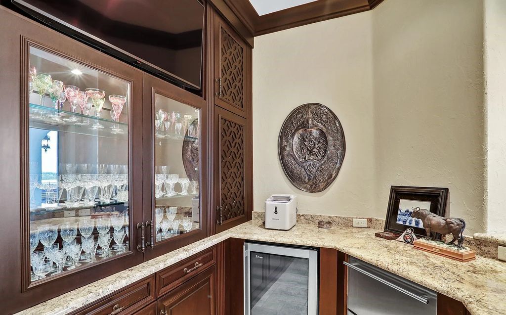 13897 Bella Riva Lane, Jacksonville, Florida, is located on the intracoastal waterway in prestigious Queen's Harbour and is perfect for formal or casual entertaining. The elegant, contemporary home has a 2-story layout with panoramic vistas of the Intracoastal and marshes, offering privacy and spectacular views.