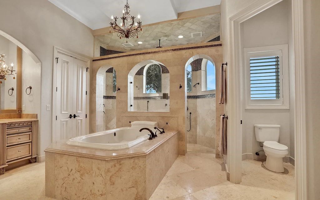 13897 Bella Riva Lane, Jacksonville, Florida, is located on the intracoastal waterway in prestigious Queen's Harbour and is perfect for formal or casual entertaining. The elegant, contemporary home has a 2-story layout with panoramic vistas of the Intracoastal and marshes, offering privacy and spectacular views.