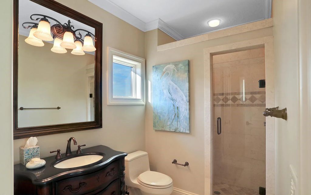 13897 Bella Riva Lane, Jacksonville, Florida, is located on the intracoastal waterway in prestigious Queen's Harbour and is perfect for formal or casual entertaining. The elegant, contemporary home has a 2-story layout with panoramic vistas of the Intracoastal and marshes, offering privacy and spectacular views.