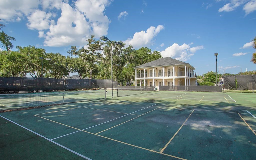 13897 Bella Riva Lane, Jacksonville, Florida, is located on the intracoastal waterway in prestigious Queen's Harbour and is perfect for formal or casual entertaining. The elegant, contemporary home has a 2-story layout with panoramic vistas of the Intracoastal and marshes, offering privacy and spectacular views.