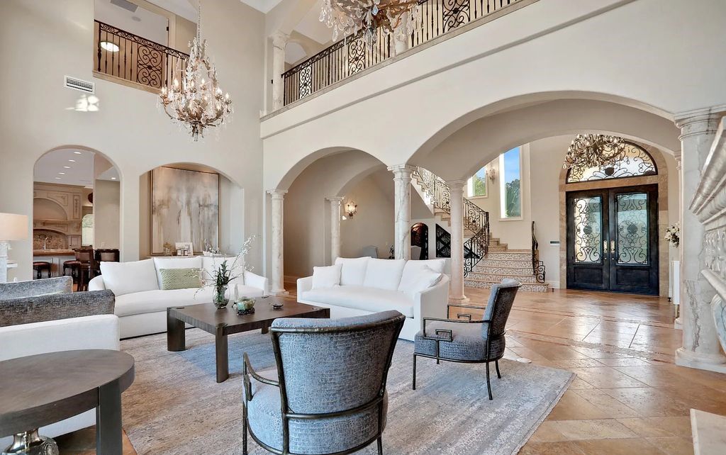13897 Bella Riva Lane, Jacksonville, Florida, is located on the intracoastal waterway in prestigious Queen's Harbour and is perfect for formal or casual entertaining. The elegant, contemporary home has a 2-story layout with panoramic vistas of the Intracoastal and marshes, offering privacy and spectacular views.
