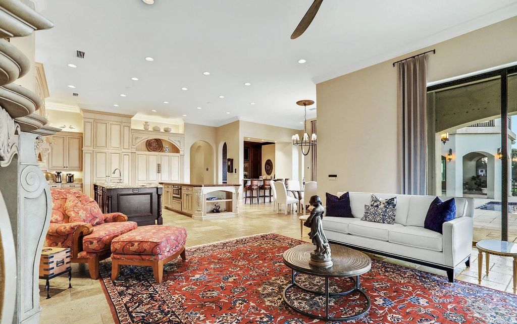 13897 Bella Riva Lane, Jacksonville, Florida, is located on the intracoastal waterway in prestigious Queen's Harbour and is perfect for formal or casual entertaining. The elegant, contemporary home has a 2-story layout with panoramic vistas of the Intracoastal and marshes, offering privacy and spectacular views.