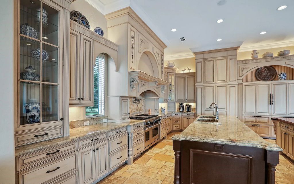 13897 Bella Riva Lane, Jacksonville, Florida, is located on the intracoastal waterway in prestigious Queen's Harbour and is perfect for formal or casual entertaining. The elegant, contemporary home has a 2-story layout with panoramic vistas of the Intracoastal and marshes, offering privacy and spectacular views.