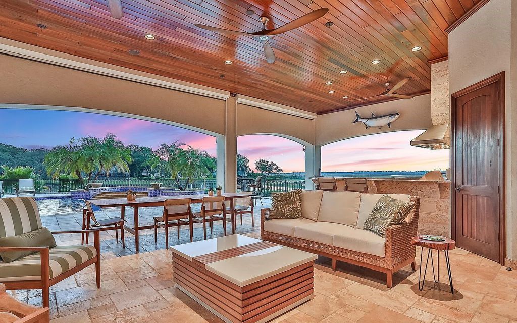 13897 Bella Riva Lane, Jacksonville, Florida, is located on the intracoastal waterway in prestigious Queen's Harbour and is perfect for formal or casual entertaining. The elegant, contemporary home has a 2-story layout with panoramic vistas of the Intracoastal and marshes, offering privacy and spectacular views.
