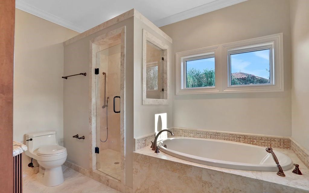 13897 Bella Riva Lane, Jacksonville, Florida, is located on the intracoastal waterway in prestigious Queen's Harbour and is perfect for formal or casual entertaining. The elegant, contemporary home has a 2-story layout with panoramic vistas of the Intracoastal and marshes, offering privacy and spectacular views.