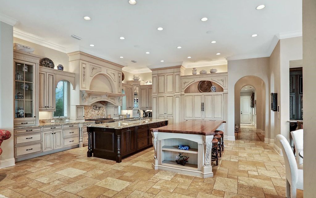 13897 Bella Riva Lane, Jacksonville, Florida, is located on the intracoastal waterway in prestigious Queen's Harbour and is perfect for formal or casual entertaining. The elegant, contemporary home has a 2-story layout with panoramic vistas of the Intracoastal and marshes, offering privacy and spectacular views.