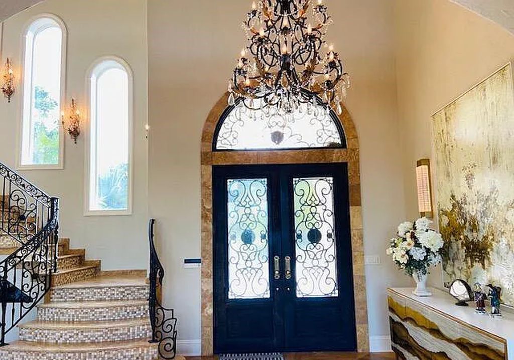 13897 Bella Riva Lane, Jacksonville, Florida, is located on the intracoastal waterway in prestigious Queen's Harbour and is perfect for formal or casual entertaining. The elegant, contemporary home has a 2-story layout with panoramic vistas of the Intracoastal and marshes, offering privacy and spectacular views.