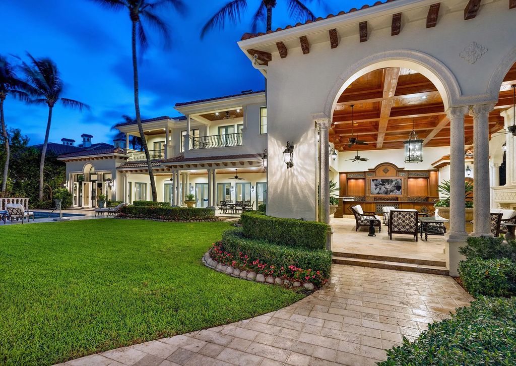 1207 Spanish River Road, Boca Raton, Florida is situated on a beautifully landscaped half-acre lot with breathtaking Intracoastal Waterway sunset views from the loggias and balconies of this magnificent estate. The ultimate Boca Raton, South Florida oasis features unparalleled magnificence, timeless beauty, and provides a unique opportunity to experience a luxury lifestyle at its most refined.