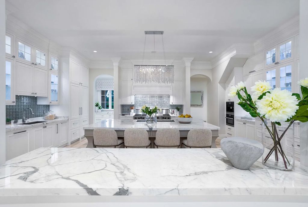 1207 Spanish River Road, Boca Raton, Florida is situated on a beautifully landscaped half-acre lot with breathtaking Intracoastal Waterway sunset views from the loggias and balconies of this magnificent estate. The ultimate Boca Raton, South Florida oasis features unparalleled magnificence, timeless beauty, and provides a unique opportunity to experience a luxury lifestyle at its most refined.