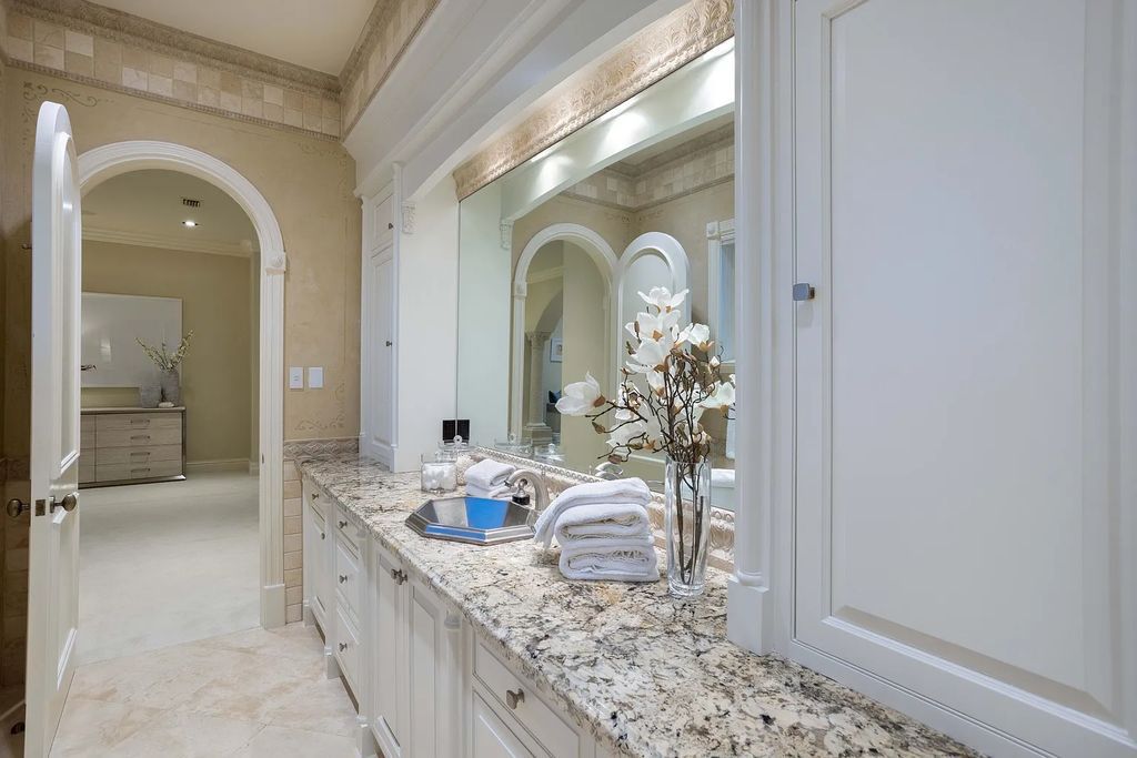 1207 Spanish River Road, Boca Raton, Florida is situated on a beautifully landscaped half-acre lot with breathtaking Intracoastal Waterway sunset views from the loggias and balconies of this magnificent estate. The ultimate Boca Raton, South Florida oasis features unparalleled magnificence, timeless beauty, and provides a unique opportunity to experience a luxury lifestyle at its most refined.