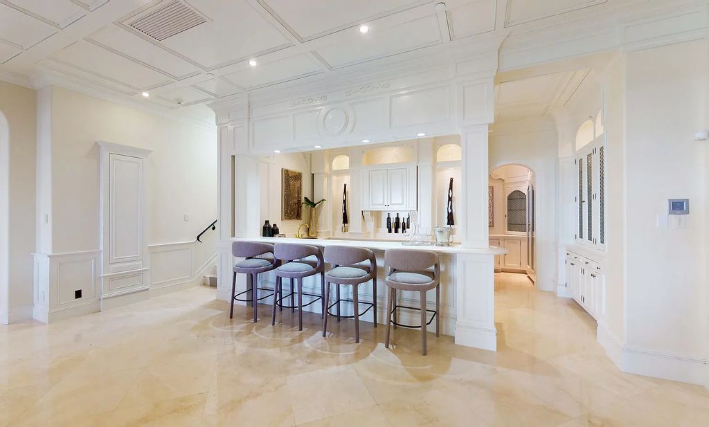 1207 Spanish River Road, Boca Raton, Florida is situated on a beautifully landscaped half-acre lot with breathtaking Intracoastal Waterway sunset views from the loggias and balconies of this magnificent estate. The ultimate Boca Raton, South Florida oasis features unparalleled magnificence, timeless beauty, and provides a unique opportunity to experience a luxury lifestyle at its most refined.