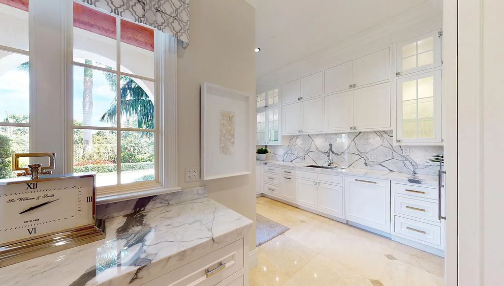 1207 Spanish River Road, Boca Raton, Florida is situated on a beautifully landscaped half-acre lot with breathtaking Intracoastal Waterway sunset views from the loggias and balconies of this magnificent estate. The ultimate Boca Raton, South Florida oasis features unparalleled magnificence, timeless beauty, and provides a unique opportunity to experience a luxury lifestyle at its most refined.