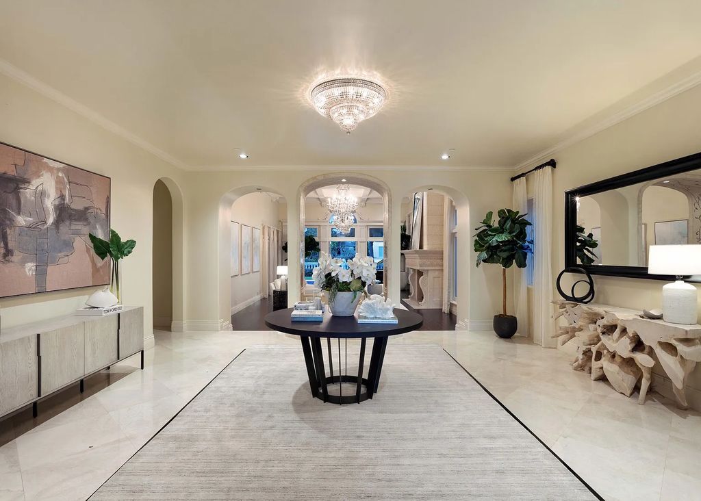 1207 Spanish River Road, Boca Raton, Florida is situated on a beautifully landscaped half-acre lot with breathtaking Intracoastal Waterway sunset views from the loggias and balconies of this magnificent estate. The ultimate Boca Raton, South Florida oasis features unparalleled magnificence, timeless beauty, and provides a unique opportunity to experience a luxury lifestyle at its most refined.