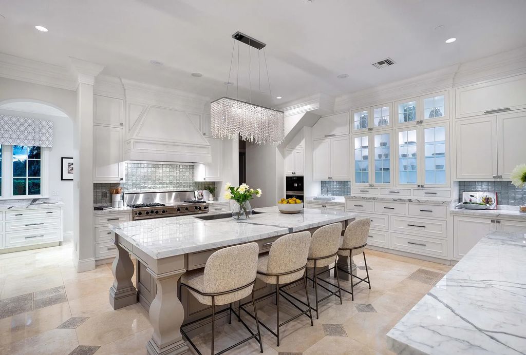 1207 Spanish River Road, Boca Raton, Florida is situated on a beautifully landscaped half-acre lot with breathtaking Intracoastal Waterway sunset views from the loggias and balconies of this magnificent estate. The ultimate Boca Raton, South Florida oasis features unparalleled magnificence, timeless beauty, and provides a unique opportunity to experience a luxury lifestyle at its most refined.