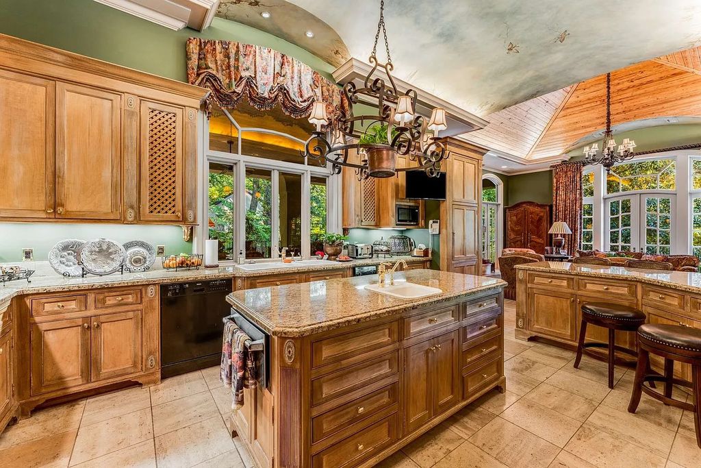 The Home in Nashville provides extensive landscaping throughout the property with dogwoods, hydrangeas and a meandering creek, now available for sale. This home located at 1310 Chickering Rd, Nashville, Tennessee