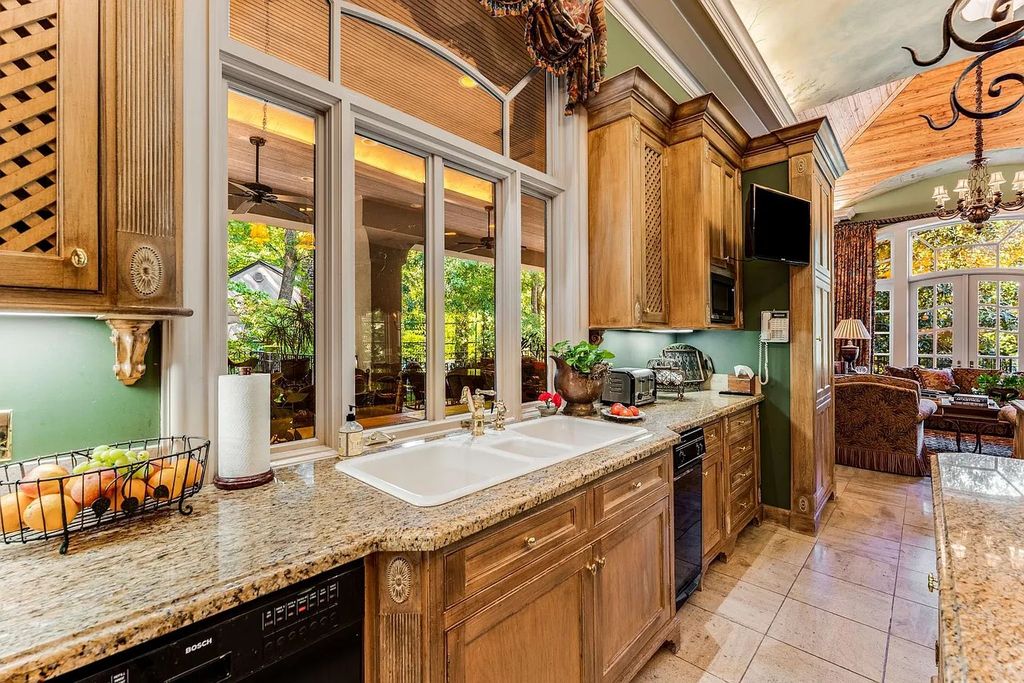 The Home in Nashville provides extensive landscaping throughout the property with dogwoods, hydrangeas and a meandering creek, now available for sale. This home located at 1310 Chickering Rd, Nashville, Tennessee