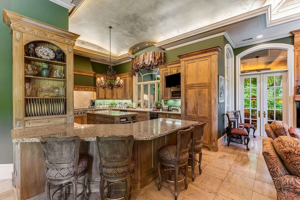 The Home in Nashville provides extensive landscaping throughout the property with dogwoods, hydrangeas and a meandering creek, now available for sale. This home located at 1310 Chickering Rd, Nashville, Tennessee
