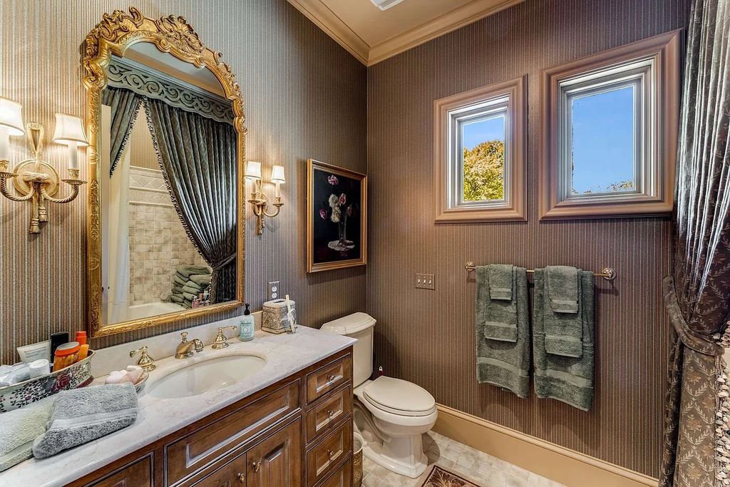 The Home in Nashville provides extensive landscaping throughout the property with dogwoods, hydrangeas and a meandering creek, now available for sale. This home located at 1310 Chickering Rd, Nashville, Tennessee