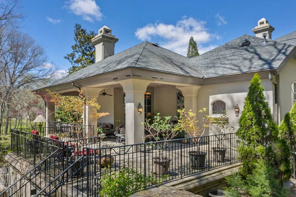 The Home in Nashville provides extensive landscaping throughout the property with dogwoods, hydrangeas and a meandering creek, now available for sale. This home located at 1310 Chickering Rd, Nashville, Tennessee